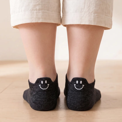 Black smile ankle socks worn